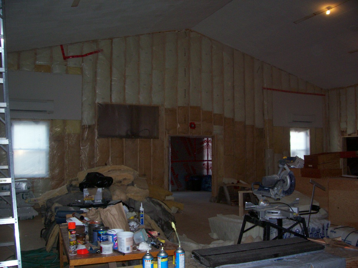 Insulating and Vapor Barrier. Building is heated.