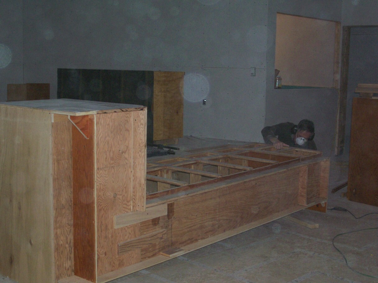 Sanding the cabinets.